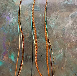 3 of the same Bonded Feather Extensions Orange Teal Black